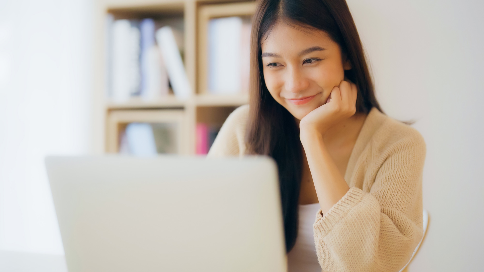 Woman working on laptop computer